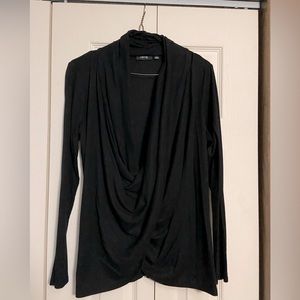 Long sleeve lightweight sweater with deep scoop.